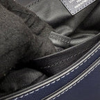 Louis Vuitton serial stamp MS1222 inside blue bag near zipper track.