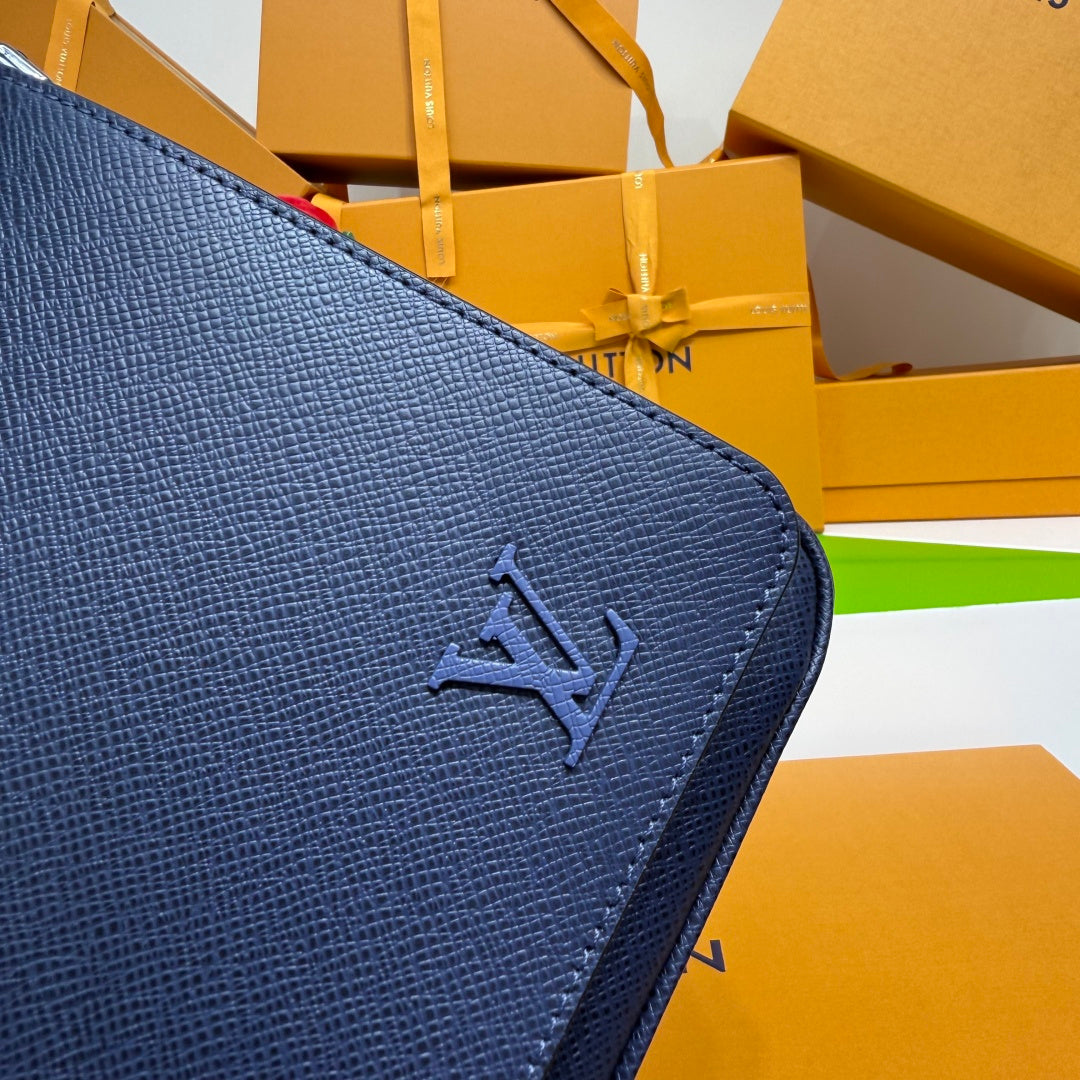 Men's Louis Vuitton bag, dark blue flap with embossed LV logo on textured leather