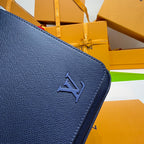 Louis Vuitton blue bag corner with embossed LV monogram.