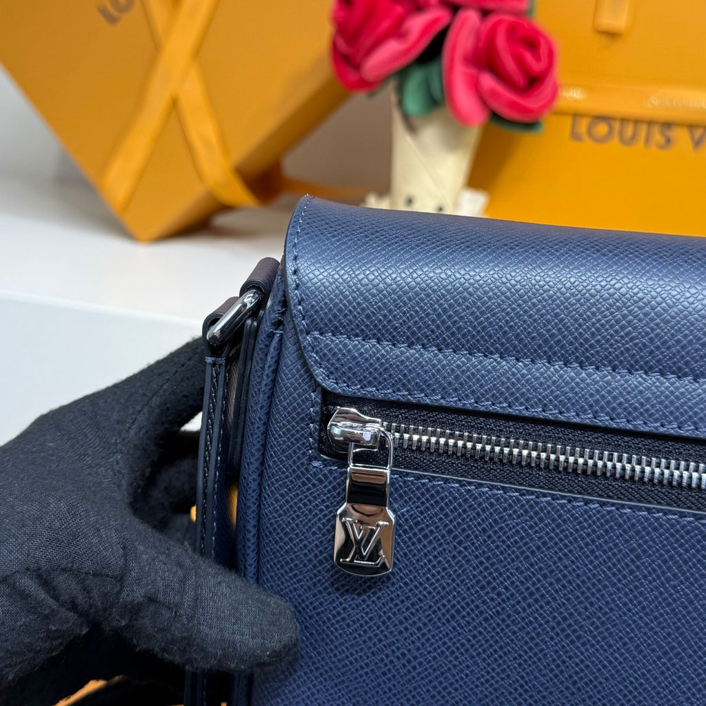 Men's Louis Vuitton bag, dark blue front with zipper pull and LV-branded lock charm