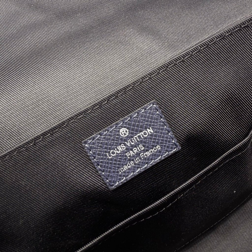 Men's Louis Vuitton bag interior label patch on dark lining fabric