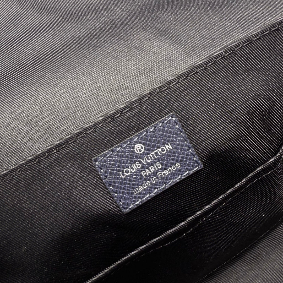 Men's Louis Vuitton bag interior label patch on dark lining fabric