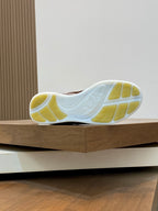 Burberry sneaker outsole with white tread and yellow rubber panels