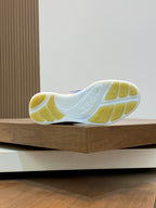 Burberry sneaker outsole with white tread and yellow traction blocks