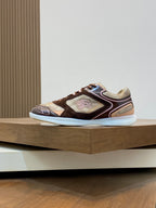 Burberry lace-up sneakers with brown, beige, and cream panels and a white outsole