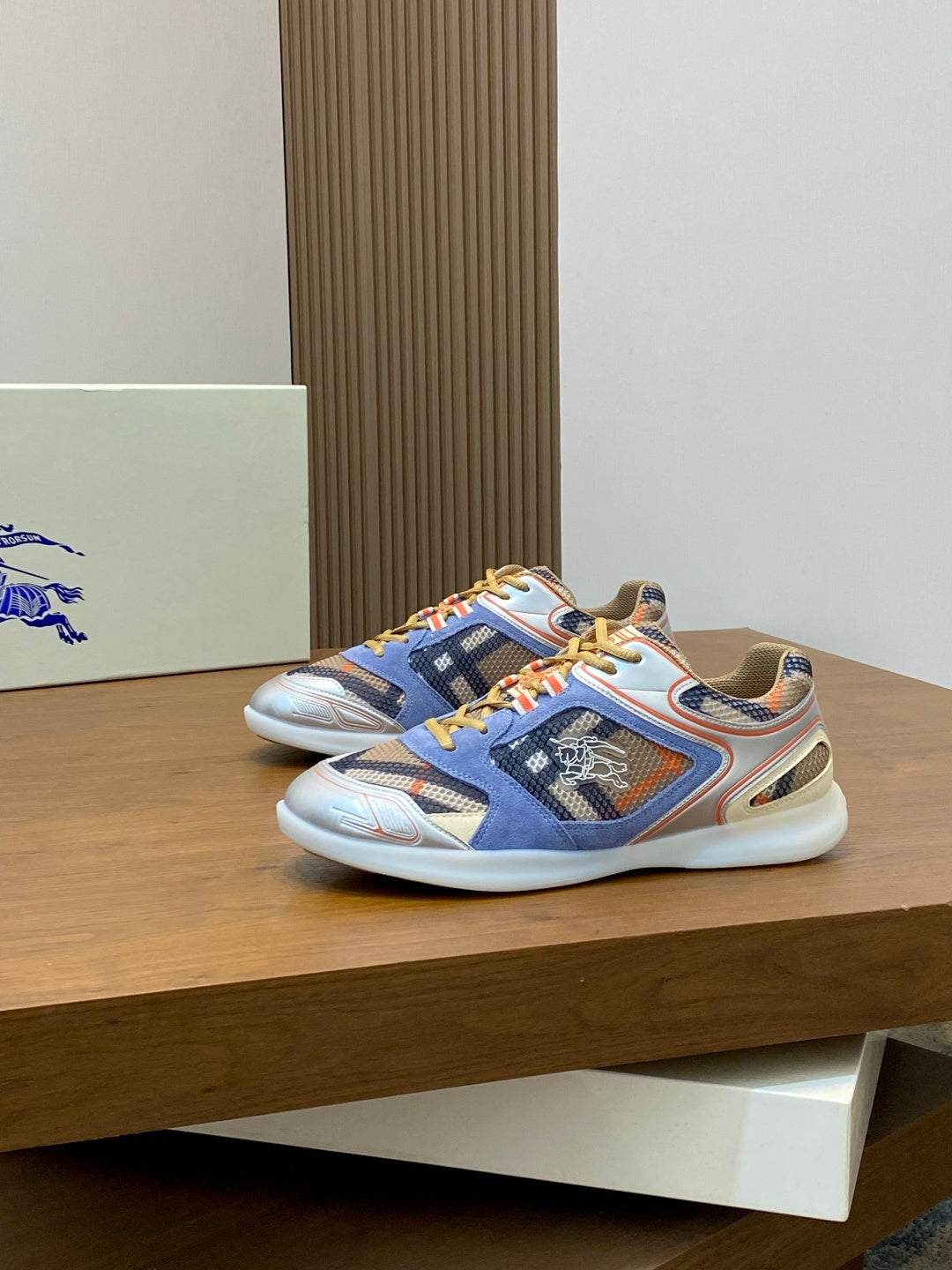 Burberry blue lace-up sneakers with multicolor laces and patterned logo panel