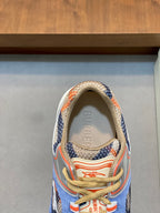 Burberry sneakers close-up of tongue and collar, blue fabric with orange trim