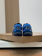 Back view of blue and black sneakers with heel pull tab, Burberry