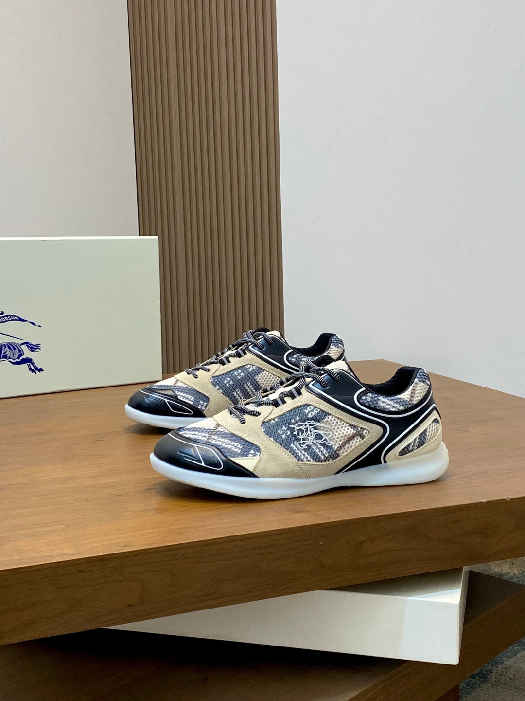 Pair of low-top lace-up sneakers in beige and navy with patterned detailing