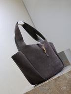 Dark gray suede tote bag with short handles and front YSL logo charm