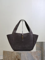 Dark gray suede tote bag with short handles and YSL logo charm