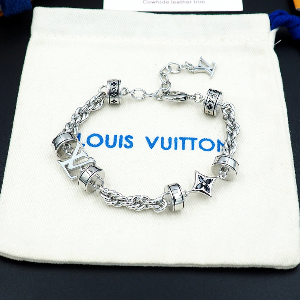 Louis Vuitton charm bracelet on pouch, silver linked chain with logo beads and star charm