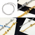 Louis Vuitton charm bracelet details, silver and gold logo bead links with star charms