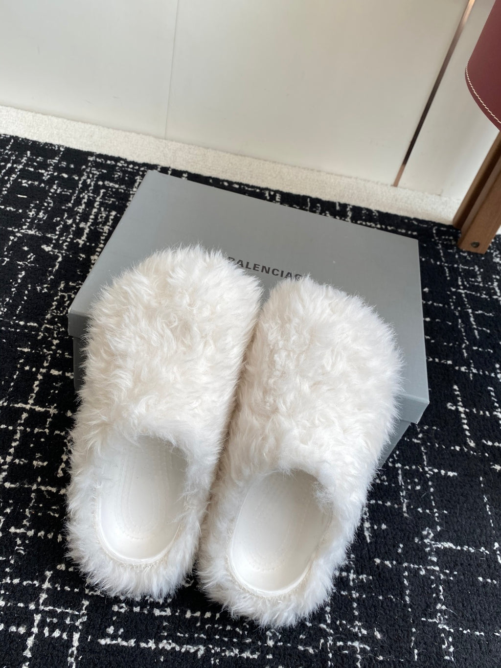 White faux-fur slide sandals, showing the open toe and rounded front
