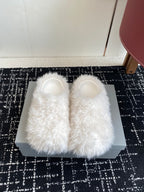 White faux-fur slip-on sandals with open toe and wide, fluffy upper