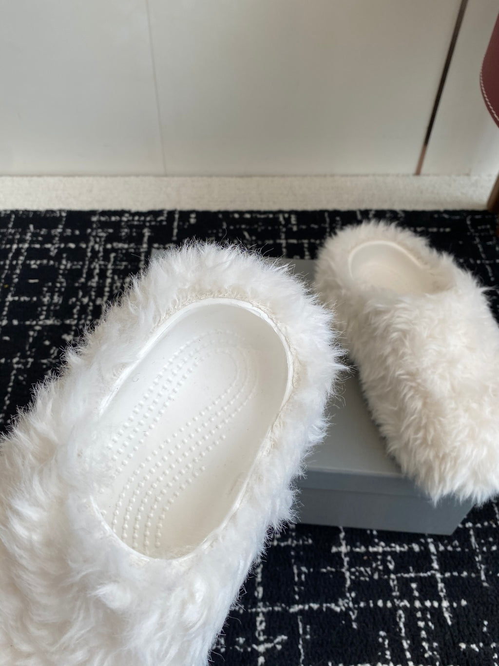 White faux-fur slide sandals with textured insole visible through open toe
