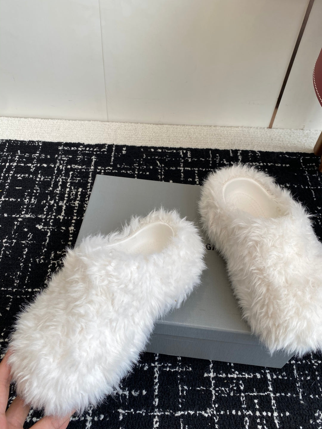 White faux-fur sandals with open toe, shown at an angle for front and side