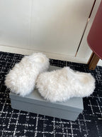 White faux-fur slip-on sandals with open toe and thick, textured upper