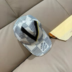 Louis Vuitton baseball cap, white with black dot pattern and neon yellow accent stripe