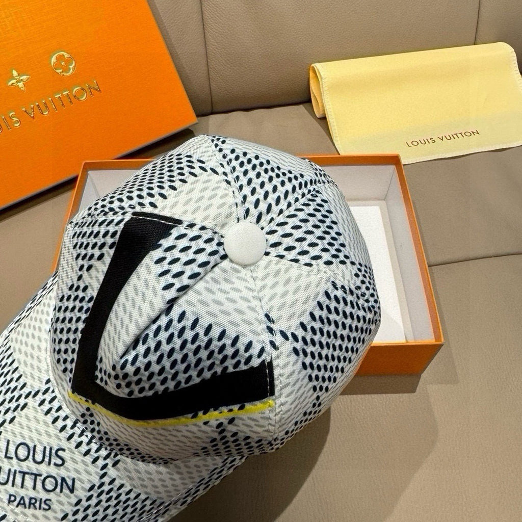 Louis Vuitton baseball cap with white-black dot print, black V stripe and yellow trim