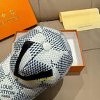 Louis Vuitton baseball cap with white-black dot print, black V stripe and yellow trim