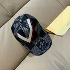 Louis Vuitton baseball cap, side view with white geometric pattern and red trim
