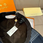 Louis Vuitton baseball cap, interior lining and hanging tag on dark strap