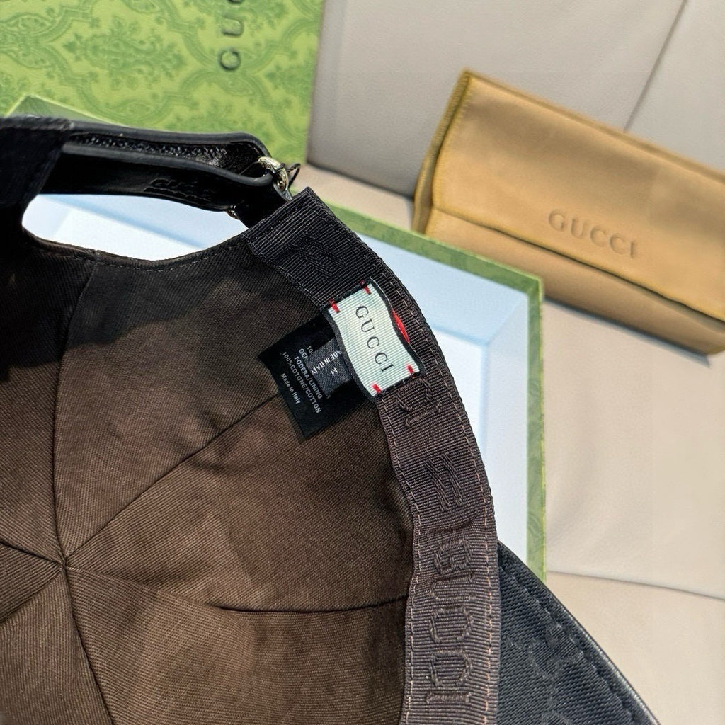 Gucci cap interior with hanging tag and black fabric strap