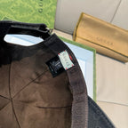 Gucci cap interior with hanging tag and black fabric strap