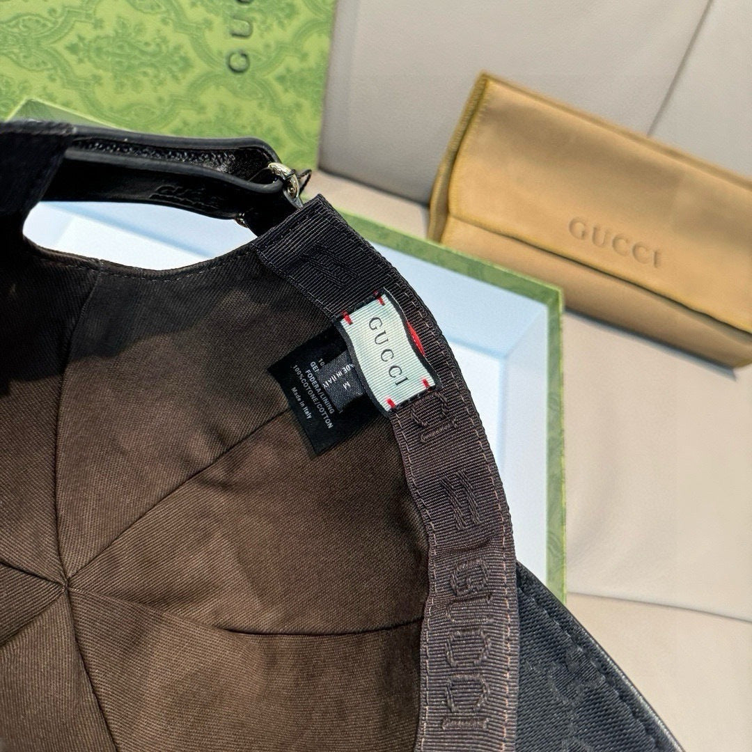 Gucci cap interior with hanging tag and black fabric strap