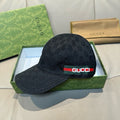 Black Gucci baseball cap with GG monogram pattern and red-green Gucci band on brim