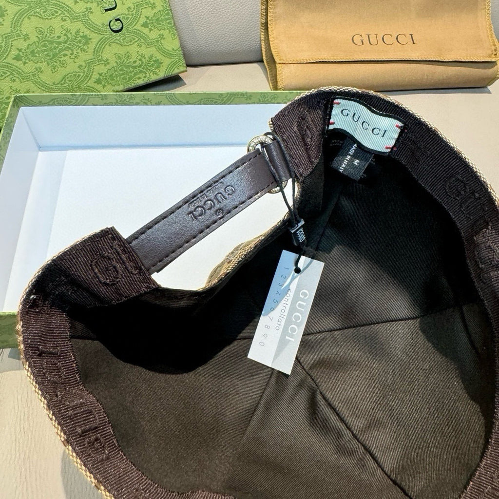 Black cap interior close-up with adjustable strap and size tag