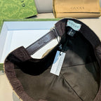 Black cap interior close-up with adjustable strap and size tag
