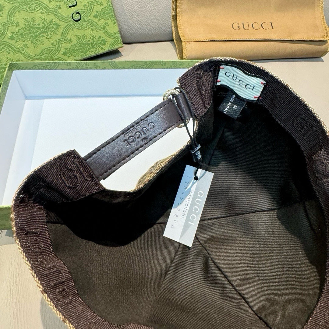 Black cap interior close-up with adjustable strap and size tag