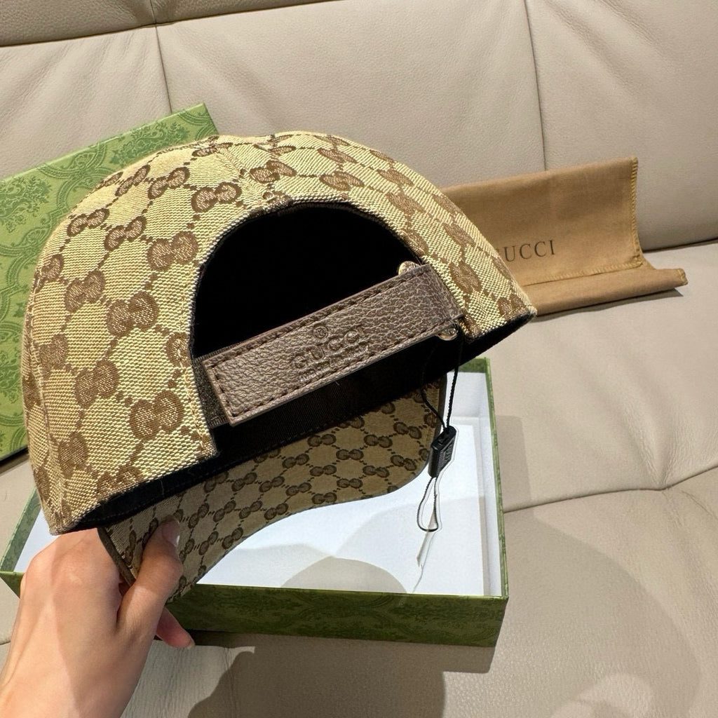 Gucci GG monogram baseball cap showing inside, beige exterior with black fabric lining.
