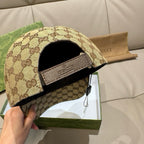 Gucci GG monogram baseball cap showing inside, beige exterior with black fabric lining.