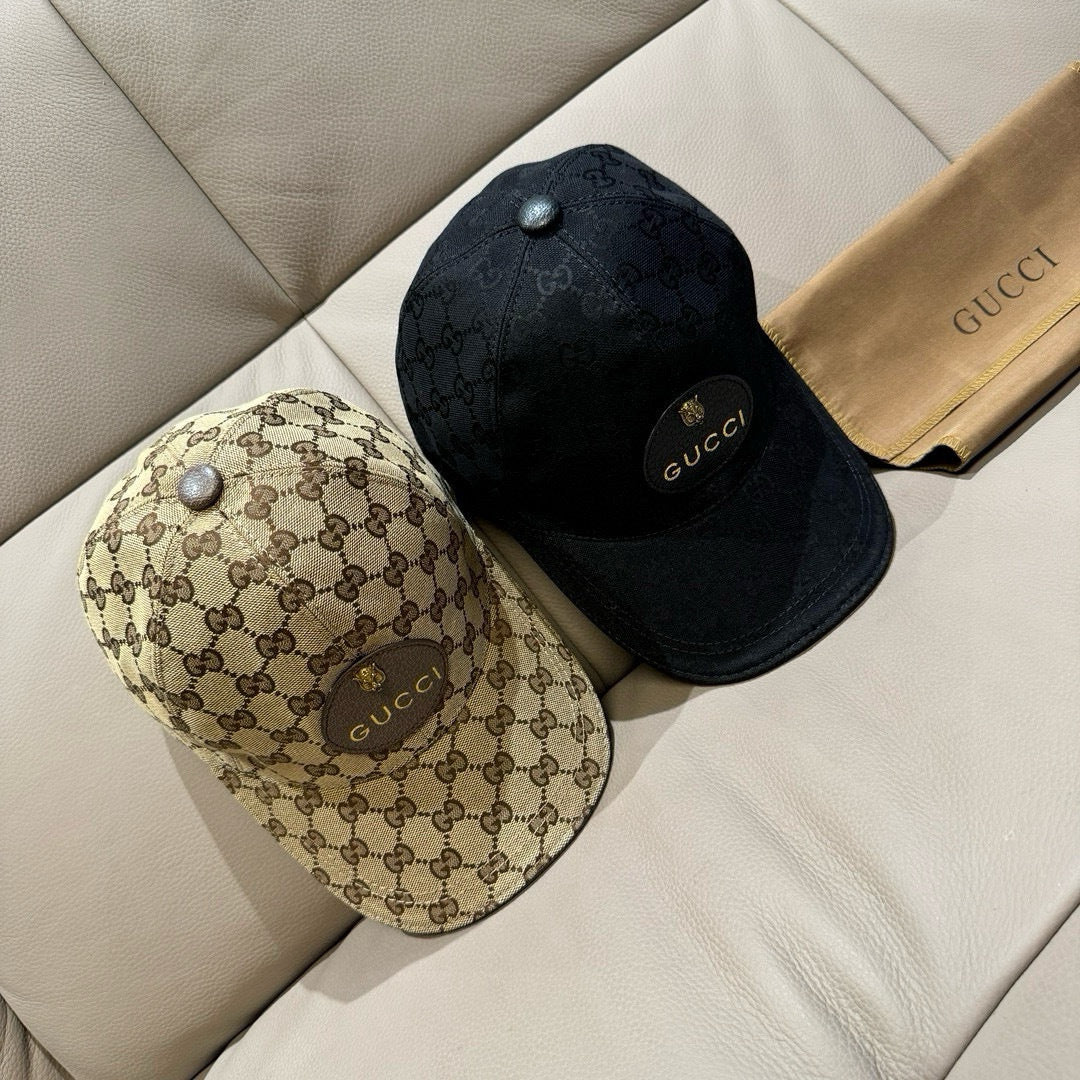 Gucci caps set: one beige GG monogram cap and one black cap with Gucci logo badge.