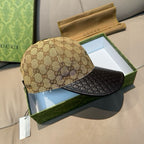 Gucci cap front view with beige GG canvas crown and black textured brim