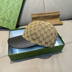 Gucci cap side view with beige GG canvas crown and black brim on box