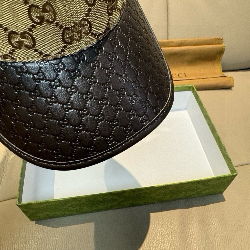 Gucci cap close-up of black textured side panel with beige GG upper