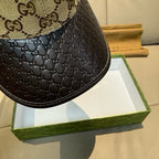 Gucci cap close-up of black textured side panel with beige GG upper