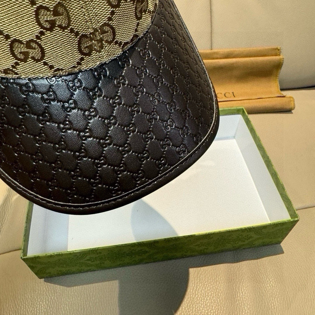 Gucci cap close-up of black textured side panel with beige GG upper