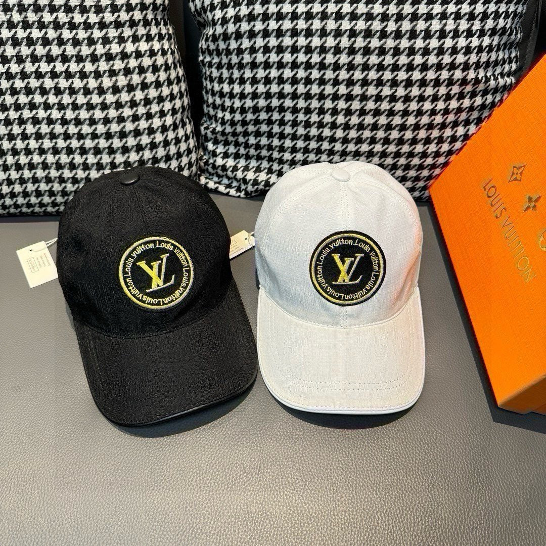 Pair of Louis Vuitton baseball caps: one dark black and one light gray/white with LV logo.