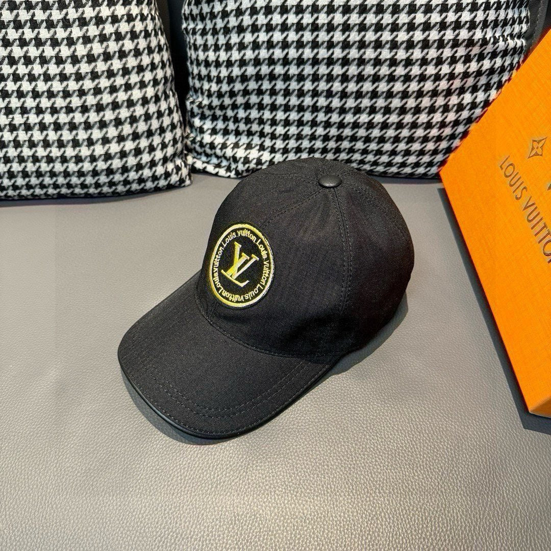 Louis Vuitton baseball cap in dark black, side view with yellow LV logo patch.