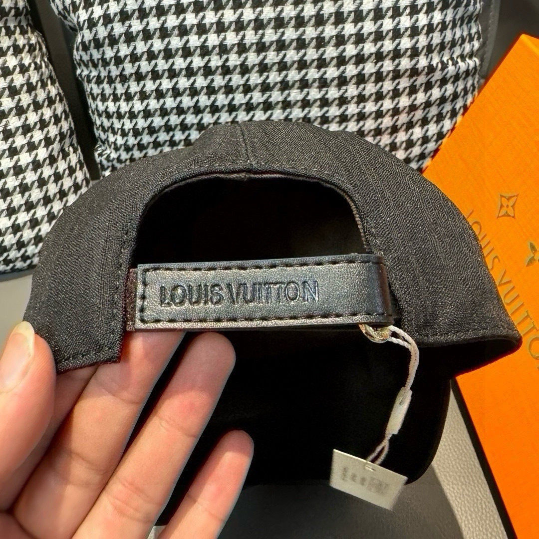 Louis Vuitton baseball cap interior with fabric strap and Louis Vuitton label patch.