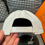 Louis Vuitton white cap with interior band and stitched logo label