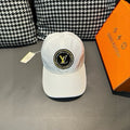 Louis Vuitton white baseball cap with embroidered LV logo patch on front