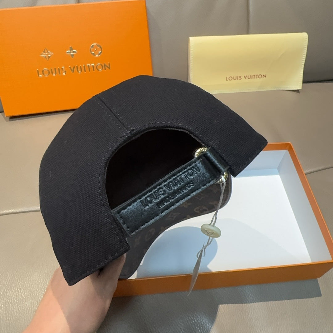 Louis Vuitton cap with black crown and brown monogram strap patch, buckle detail.