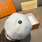 Louis Vuitton cap with white crown and brown monogram brim, side button and trim