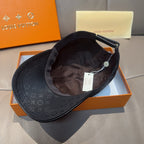 Louis Vuitton monogram baseball cap interior view, dark fabric with hanging tag